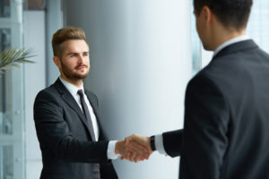 A man of integrity shaking hands with another man